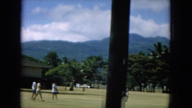 1964: Boy Running Across Field Away From Animal Quarantine Area in Hawaii