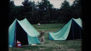 1966: a campground in the woods with the occupants away and vehicles