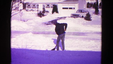 1966: on heavy winter snowfall snow clearing from young boy HAGERSTOWN, MARYLAND