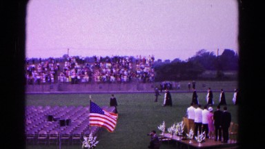 1966: a parade scene is seen with women holding a flag HAGERSTOWN, MARYLAND