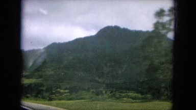 1964: beautiful green vistas driving through the mountains on a sunny day HAWAII