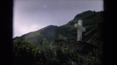 1964: jesus emblem of cross in the above mountain to save the village people.