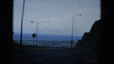 1964: vintage footage of a driver filming a mountain range