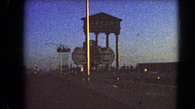1966: driving toward caesars hotel and casino sign in las vegas nevada. BARSTOW