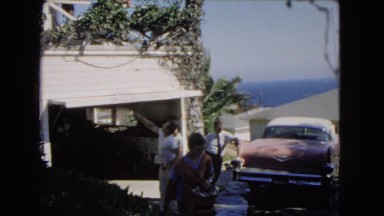 1966: A Man Cleaning the Floor with Mop Supervised by Another in Catalina, California