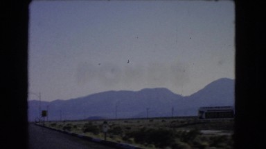 1966: a beautiful mountain ridge as seen through the window of a moving vehicle