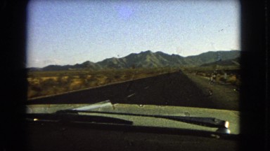 1966: a road is seen having flags along CATALINA, CALIFORNIA