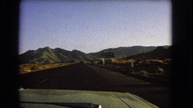 1966: unclear sign urges driver to keep right in beautiful desert landscape