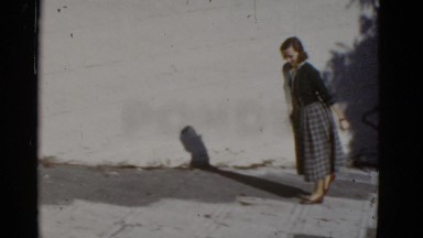 1952: a well dressed beautiful woman walking up a steep sidewalk SAN FRANCISCO
