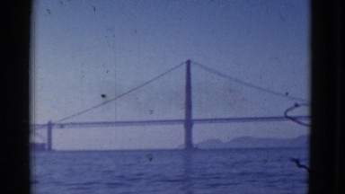1952: a bridge is seen from a mountain area with greenery and trees