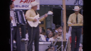 1964: musicians with various instruments enjoy a crowd on the street RACINE