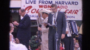 1964: live telecast of a celebration at harvard where people are enjoying