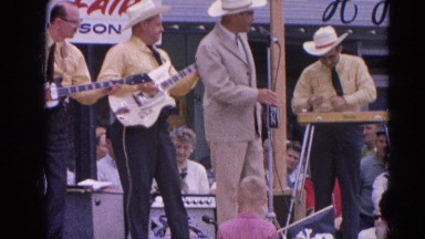 1964: a band consisting of four men plays their instruments