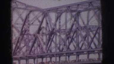 1962: a bridge is seen from a mountain area with greenery and trees