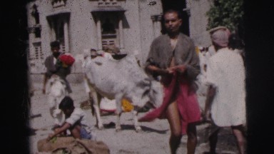1962: Man Walks Through Crowd in Calcutta Plaza