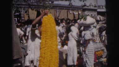 1962: A bustling market area beside a road in Calcutta