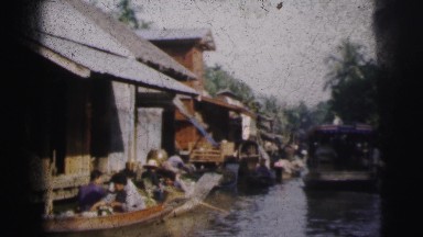 1962: a market on a boat area with water all around is seen DARJEELING