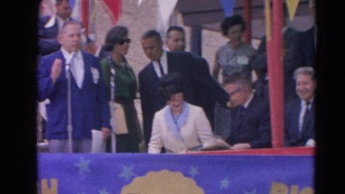1964: official address the people through the mike on the dais HARVARD,