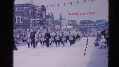 1964: marching band marches down the street during the parade HARVARD, ILLINOIS