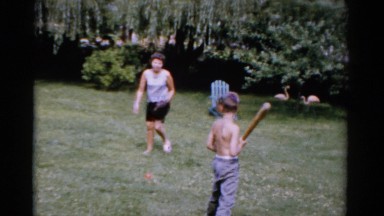 1951: a woman and children playing baseball in the yard FLORIDA