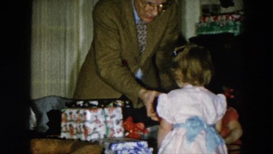 1956: grandpa showing the presents to the children HICKSVILLE, NEW YORK