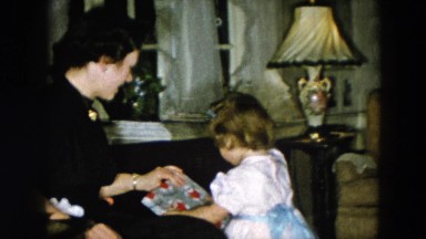 1956: little girl hands present to waiting woman HICKSVILLE, NEW YORK