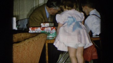 1956: grandpa showing the presents to the children HICKSVILLE, NEW YORK