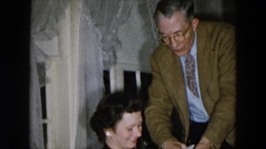 1956: mother and daughter sharing gift opening moment HICKSVILLE, NEW YORK
