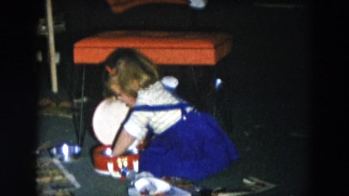 1956: little girl playing with metal bowls HICKSVILLE, NEW YORK