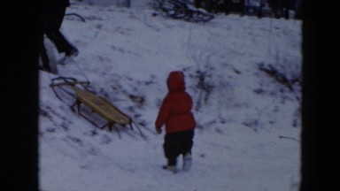 1956: playing on a snowy hill HICKSVILLE, NEW YORK
