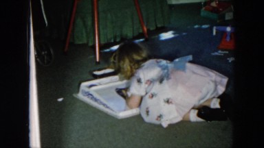 1956: girl playing with an educational toy HICKSVILLE, NEWYORK