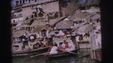 1962: many people are in a village by water and some boat away DARJEELING