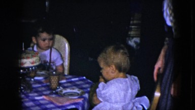 1951: 3 children and 2 adults around a birthday cake CLEVELAND, OHIO