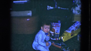 1951: a toddler having fun during the holidays with his toy phone. CLEVELAND,