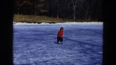 1956: child running and falling in the snow HICKSVILLE, NEW YORK
