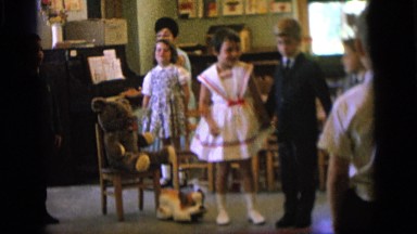 1964: children are seen indoors singing CAMDEN NEW JERSEY