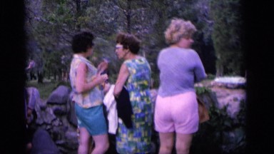 1964: adults gather for a smoke break while at the park