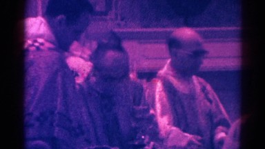 1966: catholic priest handing out communion to parishioners at church DANVILLE