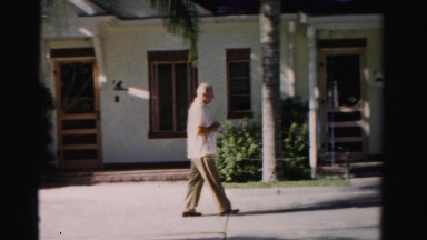 1955: man in suit is seen walking MIAMI, FLORIDA