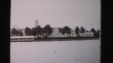 1955: coastal buildings fancy wealthy mansions boat cruise docking area MIAMI