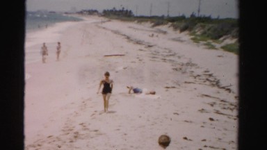 1955: women exploring beach view from above MIAMI, FLORIDA