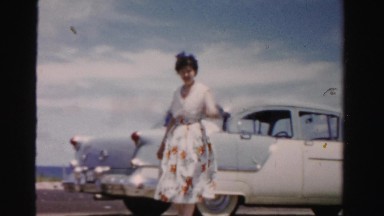 1955: woman walking and waving MIAMI, FLORIDA