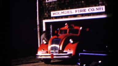1961: Old Fishing Car Driving Down the Street HAGERSTOWN, MARYLAND