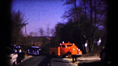 1961: firetruck and police car pull up to white home HAGERSTOWN, MARYLAND