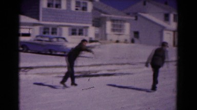 1961: boys playing outdoors in the snow covered street HAGERSTOWN, MARYLAND