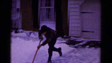 1961: boy playfully shovels snow from driveway during winter HAGERSTOWN
