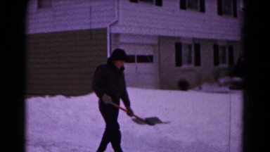 1961: Boy Attempting to Shovel Heavy Snow Down Driveway Hagerstown, Maryland