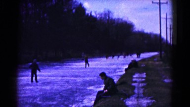 1961: ice skating on frozen river creek near forster park HAGERSTOWN, MARYLAND