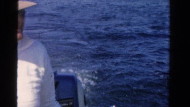 1958: man on the water operating small fishing boat MINNESOTA