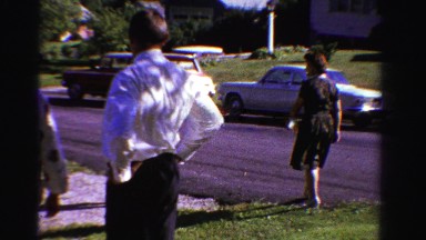 1958: family watches baby playing in the driveway MINNESOTA